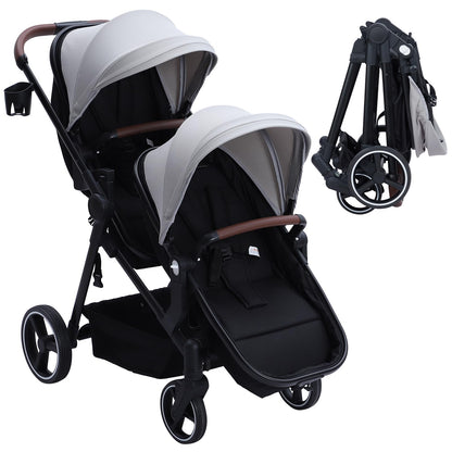 Dark grey tandem double stroller for newborn and toddler, with reversible seats, adjustable canopy, 5-point harness, and large storage basket.