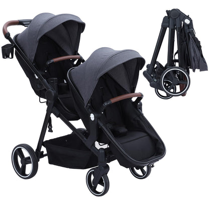 Dark grey tandem double stroller for newborn and toddler with reversible seats, adjustable canopy, 5-point harness, and large storage basket.