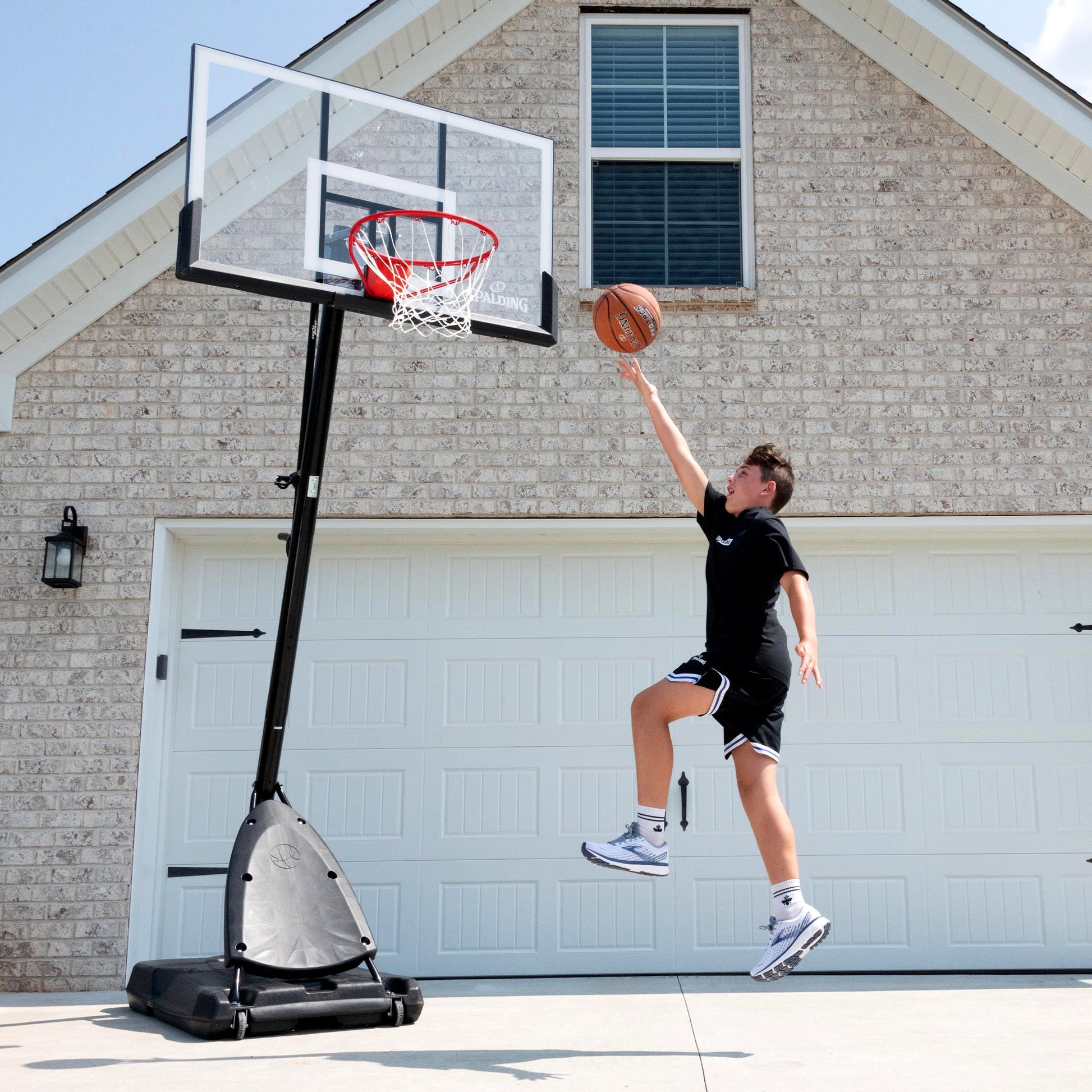 Spalding 54-Inch Portable Basketball Hoop Shatter-Proof Polycarbonate Backboard Adjustable ExactaHeight System Pro Slam Rim Outdoor