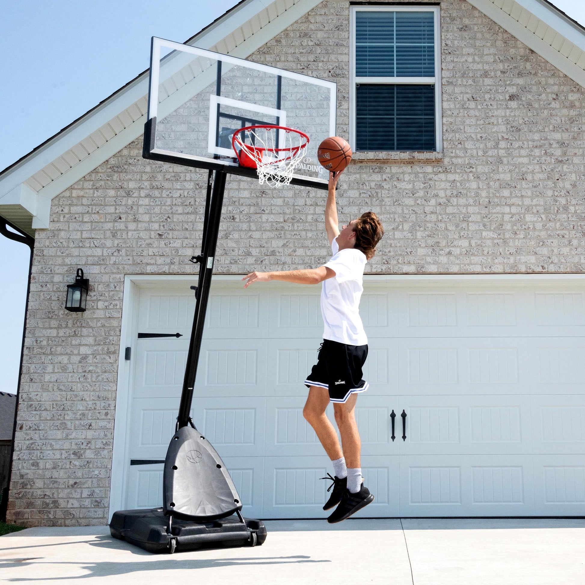 Spalding 54-Inch Portable Basketball Hoop Shatter-Proof Polycarbonate Backboard Adjustable ExactaHeight System Pro Slam Rim Outdoor